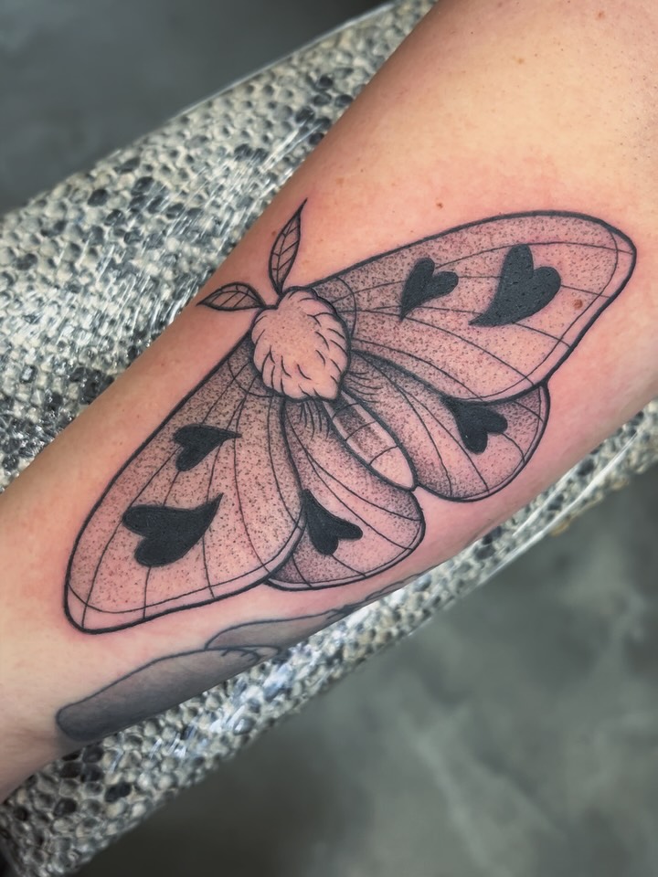 Fine line dotwork moth with heart spots tattoo